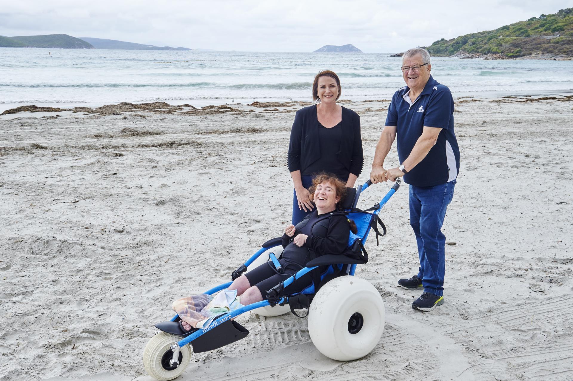 MP and former Mayor with beach-wheelchair user