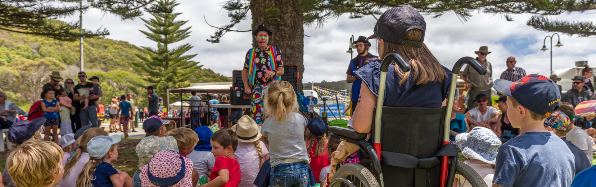 Jamie the Clown performing to a group of youth